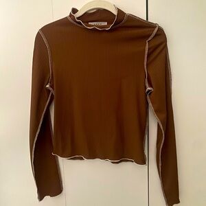 Brown mock neck long sleeve top with exterior stitching